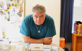 Bruce Botha takes a daily cocktail of painkillers for his spinal condition.