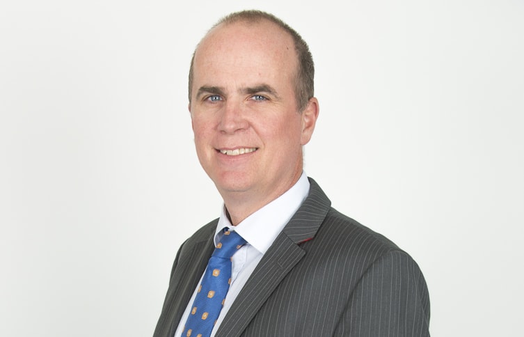 A portrait of immigration lawyer Alastair McClymont.