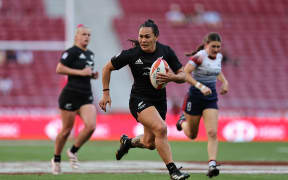 New Zealand’s Portia Woodman-Wickliffe races away from the Great Britain defence for a try on day one of the Madrid Sevens.