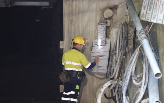 A crewman looks at list outside the 30m concrete seal at Pike River mine.