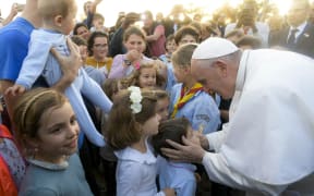 Pupils from the Catholic schools of Rabat greeting Pope Francis upon his arrival at the Apostolic Nunciature of the Holy See in Rabat