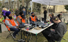 Sikh Sangat Trust members talking to Susie Ferguson in Christchurch.