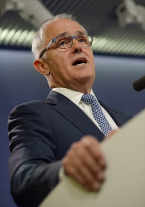 Australia's Communications Minister Malcolm Turnbull speaks at a press conference in Sydney on September 24, 2013.