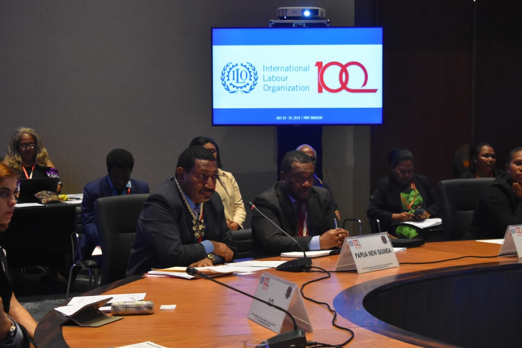 PNG Labour Minister Alfred Manase (centre with traditional necklace) at ILO conference in Port Moresby July 2019