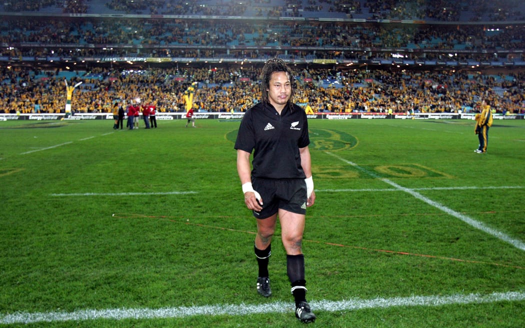 A dejected All Black captain, Tana Umaga walks off the park after the 2004 loss.