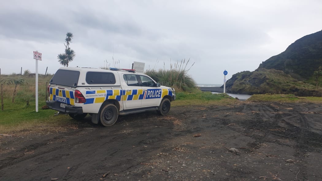 Police vehicle parked at Kiritehere Beach.