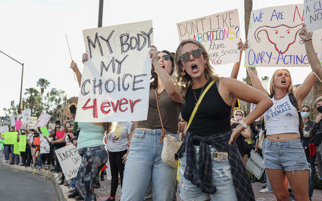 (FILES) Abortion rights protesters chant during a Pro Choice rally at the Tucson Federal Courthouse in Tucson, Arizona on Monday, July 4, 2022. The top court in Arizona, a key presidential election swing state, on April 9, 2024, ruled that a 160-year-old near total ban on abortion is enforceable, meaning that doctors performing the procedure could be jailed for five years. (Photo by SANDY HUFFAKER / AFP)