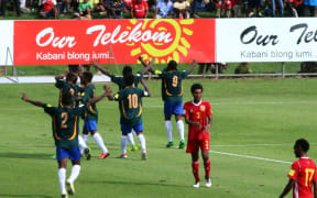 Solomon Islands celebrate a goal in their 3-2 victory against Papua New Guinea on Friday.