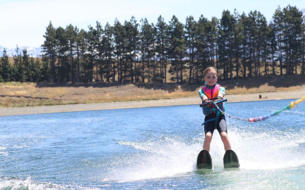Tessa Sim, 8, a third generation user of Lake Camp on the water last summer, but with declining lake levels may not get the opportunity this summer. PHOTO SUPPLIED