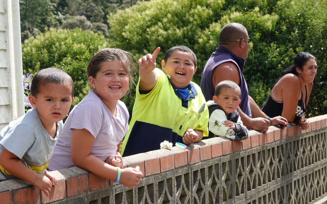 Kāeo kids watch as the parade goes by.