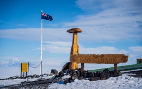 Scott Base sign and carvings.