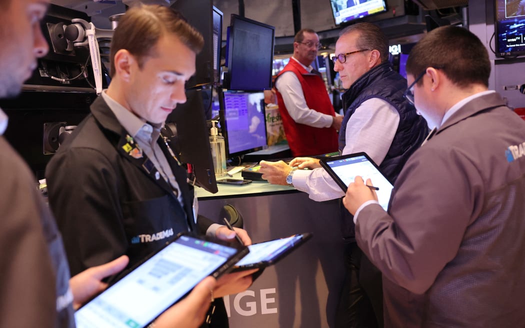 NEW YORK, NEW YORK - AUGUST 06: Traders work on the floor of the New York Stock Exchange during morning trading on August 06, 2024 in New York City. Stocks opened up slightly up in the three major indexes a day after the Dow Jones and the S & P 500 had their worst day of trading since 2022, amid a global market sell-off centered around fears of a U.S. recession.   Michael M. Santiago/Getty Images/AFP (Photo by Michael M. Santiago / GETTY IMAGES NORTH AMERICA / Getty Images via AFP)