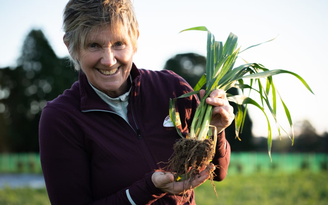 Jules Matthews, a director at Mangaroa Farms, holding some of the vegetables she has grown.