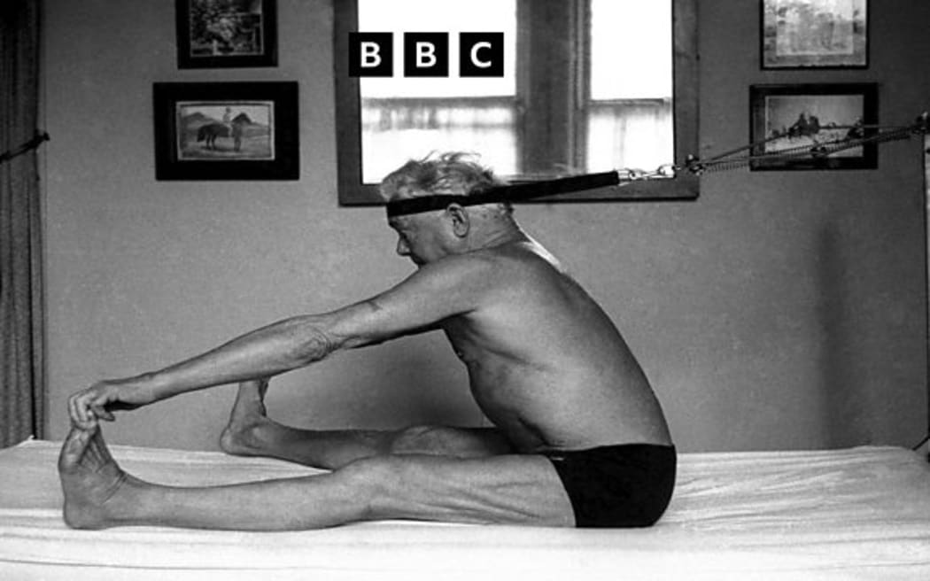 Joseph Pilates, inventor, physical fitness guru and founder of the Pilates exercise method demonstrates a technique on his 'Bednasium' in his 8th Avenue studio on October 4, 1961 in New York City, Credit