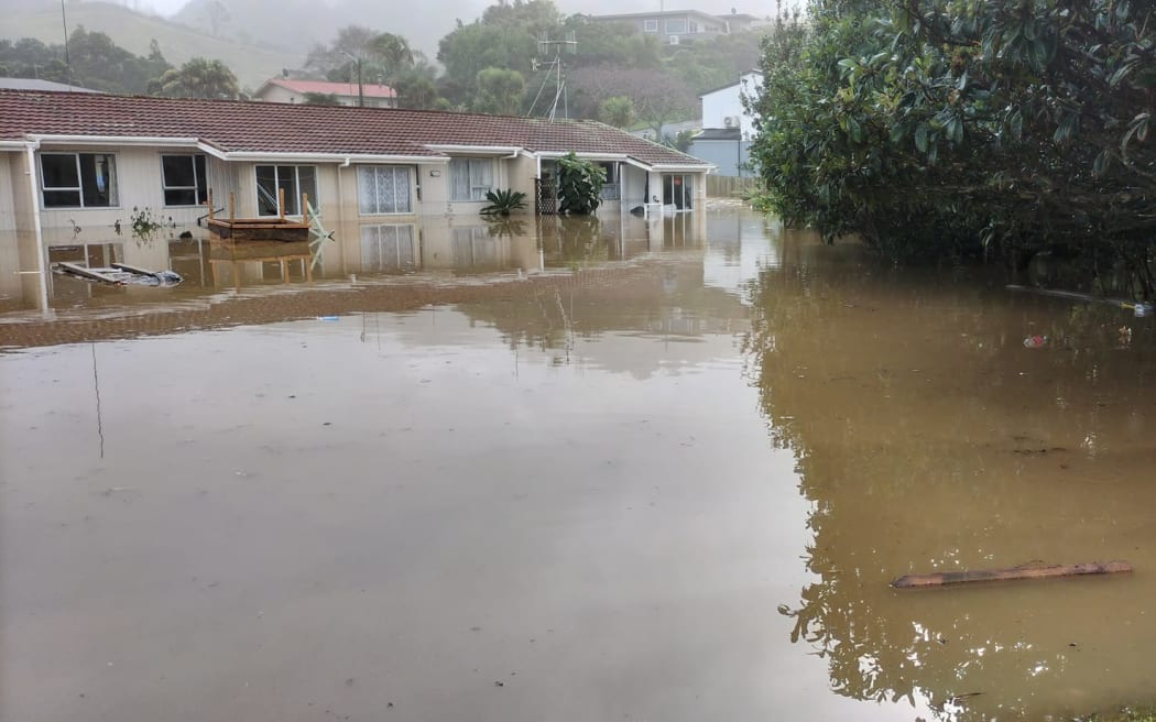 Water rose to window height in the front seven pensioner units on Beach Road. Photo: Susan Lean. [via LDR Single use only]