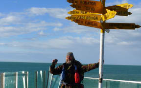 Actor and podcaster Bruce Hopkins reaches Bluff after his 3000-kilometre walk along Te Araroa.