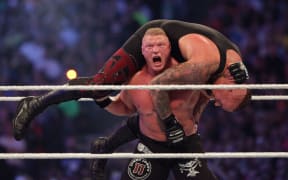 Brock Lesnar hits an F-5 on the Undertaker in their match at Wrestlemania 30