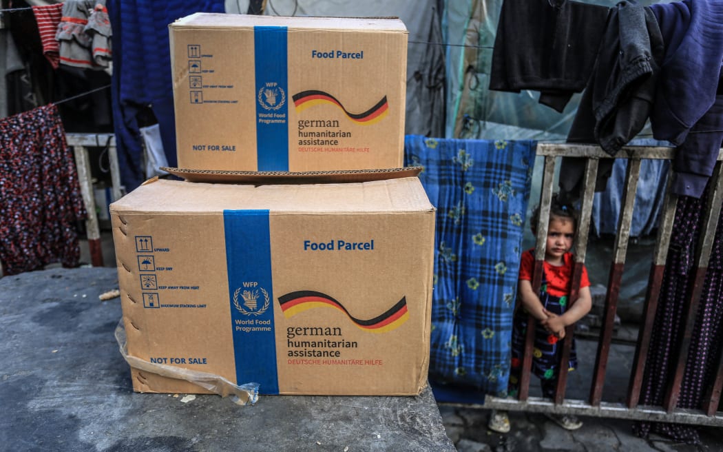 German food parcels arrive to displaced Palestinians through the World Food Organization.