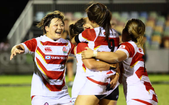 Japanese players celebrate their victory over Australia, 2022.