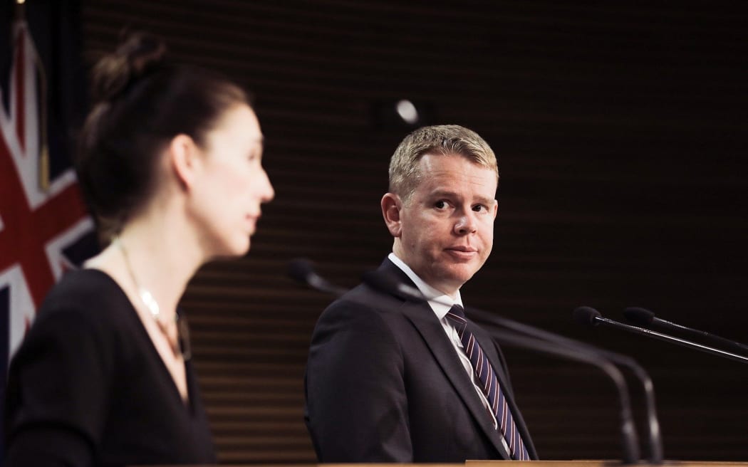 Chris Hipkins looking at Jacinda Ardern