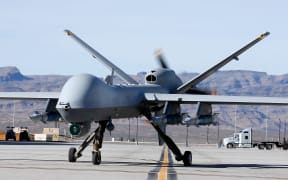A US MQ-9 Reaper remotely piloted aircraft (RPA) taxis during a training mission at Creech Air Force Base on 17 November, 2015 in Indian Springs, Nevada.