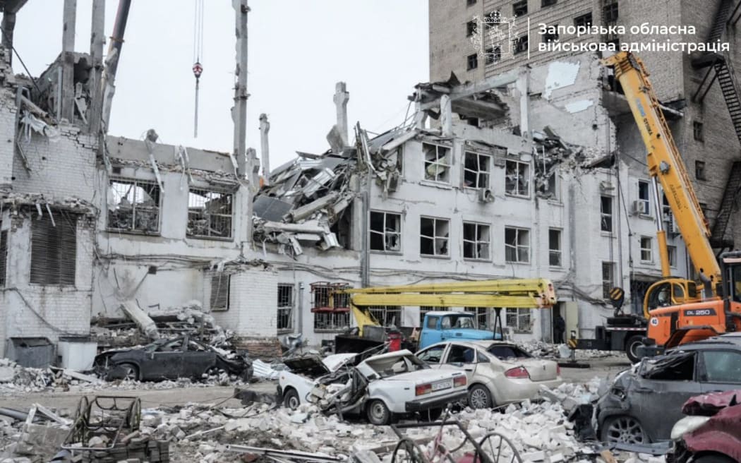 This handout photograph published on December 11, 2024, on the official Telegram channel of the head of the Zaporizhzhia Regional Military Administration Ivan Fedorov, shows a damaged building after a strike in the city of Zaporizhzhia, amid the Russian invasion of Ukraine. - A Russian strike on December 10, 2024, killed eight people and wounded 22 others including a five-year-old girl in the southern Ukrainian city of Zaporizhzhia. (Photo by Handout / Telegram / @ivan_fedorov_zp / AFP) / RESTRICTED TO EDITORIAL USE - MANDATORY CREDIT 