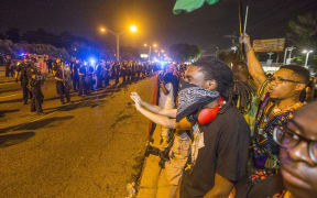 Protesters and Baton Rouge police on Saturday night.