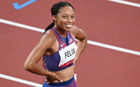 Allyson Felix of The USA celebrates after winning the bronze medal in the Women's 400m Final during the Tokyo 2020 Olympic Games at Olympic Stadium in Tokyo, Japan on August 06, 2021.