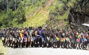 Warring tribesmen gather for the signing of the ceasefire agreement.