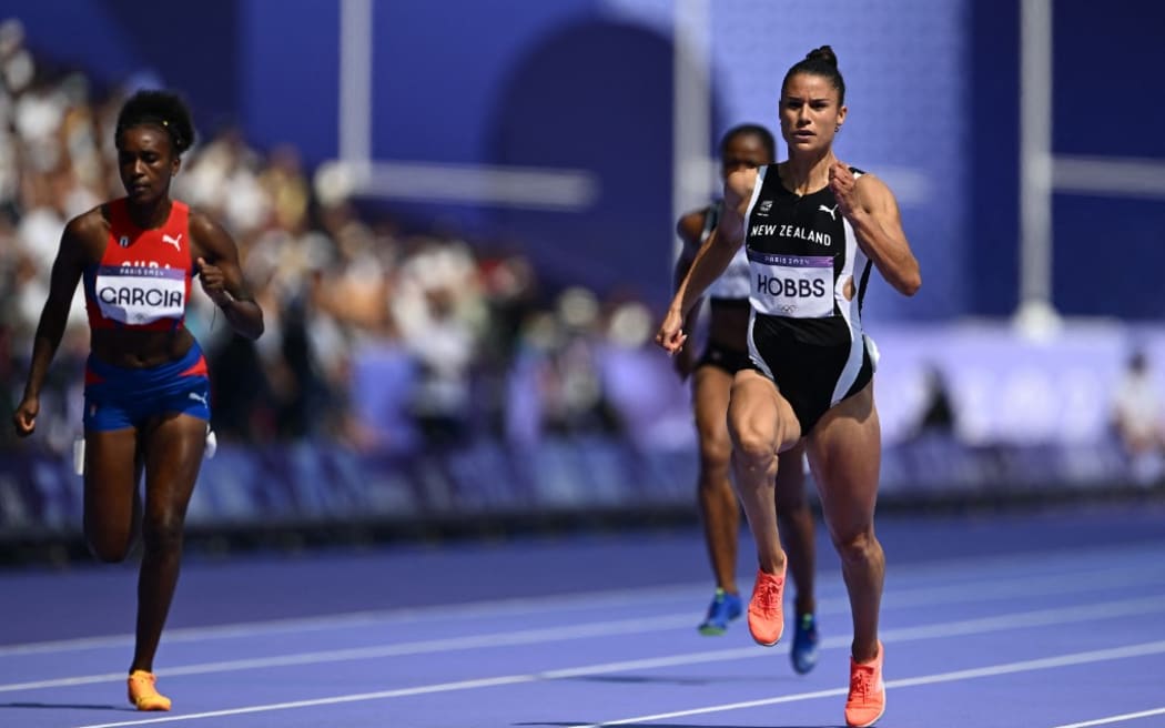 New Zealand's Zoe Hobbs competes in the women's 100m heat of the athletics event at the Paris 2024 Olympic Games at Stade de France in Saint-Denis, north of Paris, on August 2, 2024. (Photo by Jewel SAMAD / AFP)