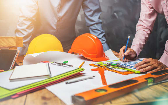 Structural engineer teamwork discussing hardworking in the office on building structure concept of worldwide building project.