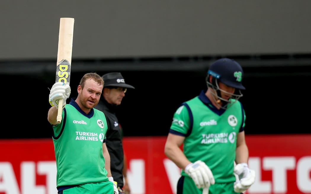 Ireland's Paul Stirling celebrates a century.