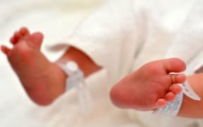 A photo of a newborn baby's feet