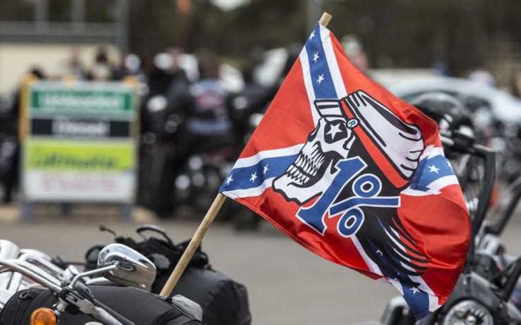 Rebels motorcycle gang flag and bikes, Australia.
