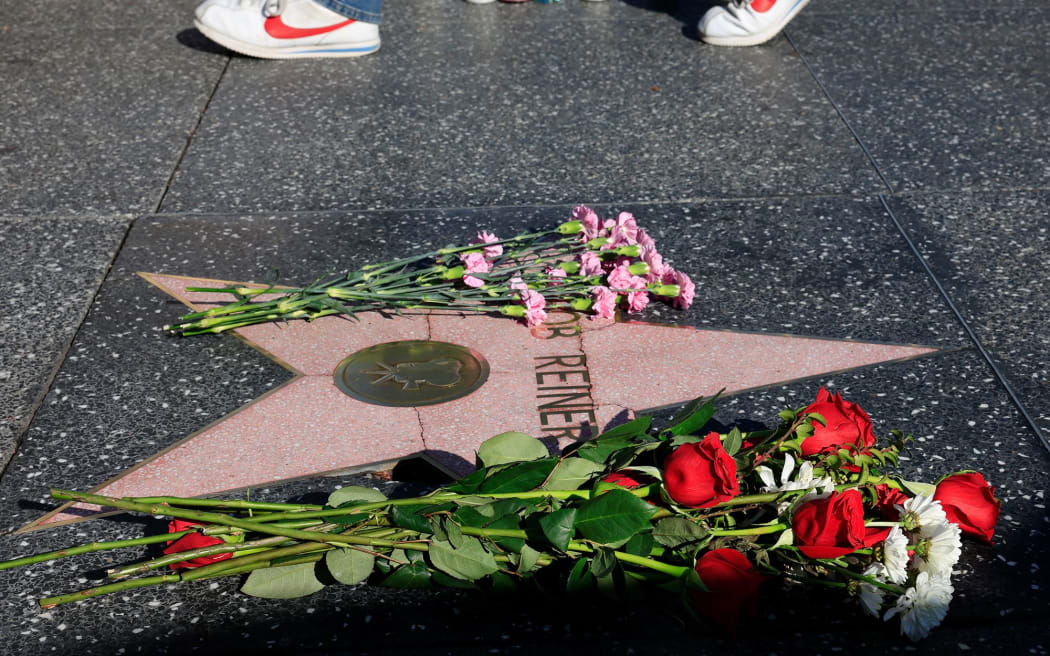Flowers rest on director Rob Reiner's star on the Hollywood Walk of Fame on 15 December in Los Angeles, California.