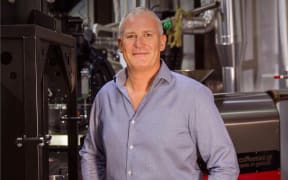 Matt Toogood stands in front of a coffee roastery he owns in the UAE