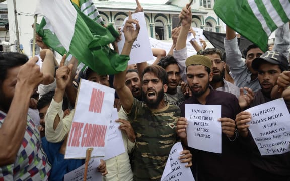 Protesters shout slogans at a rally against the Indian government's move to strip Jammu and Kashmir of its autonomy and impose a communications blackout, in Srinagar on 16 August 2019.