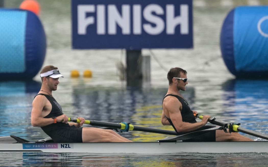 New Zealand's Daniel Williamson (L) and New Zealand's Phillip Wilson cross the finish line in first place in the men's pair final B of the rowing competition at Vaires-sur-Marne Nautical Centre in Vaires-sur-Marne during the Paris 2024 Olympic Games on August 2, 2024. (Photo by Bertrand GUAY / AFP)