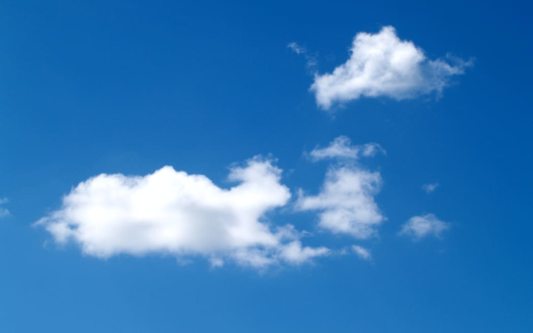 An image of a blue sky with some clouds.