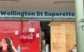 A shop's damaged store front afer it was rammed.