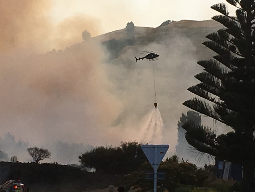 Several helicopters are being used to battle the scrub fire.