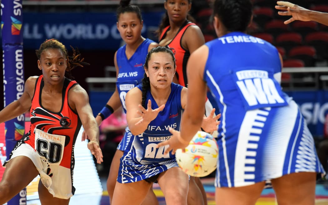 Hanalei Temese feeds the ball into the shooting circle at the Netball World Cup.