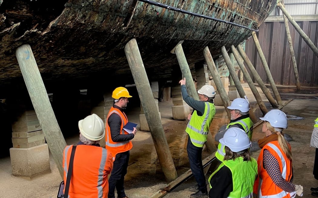 Maritime preservation experts examine the Edwin Fox at Picton.