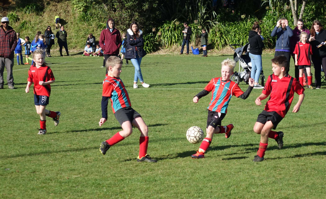 Junior soccer players from New Plymouth's Peringa Football Club compete in a tournament