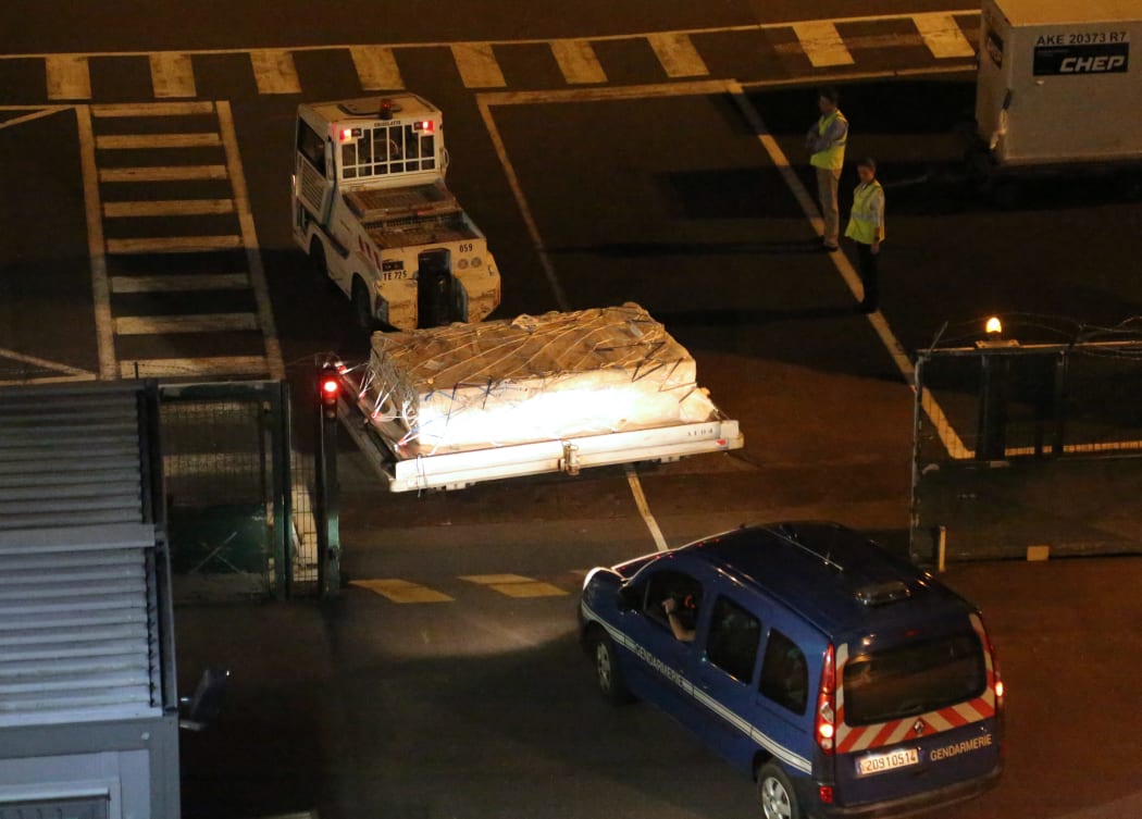 The debris was packed into a crate for the flight to Paris.