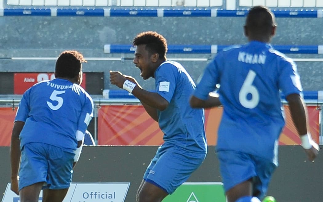 Fiji's goal scorer Iosefo Verevou celebrates history.