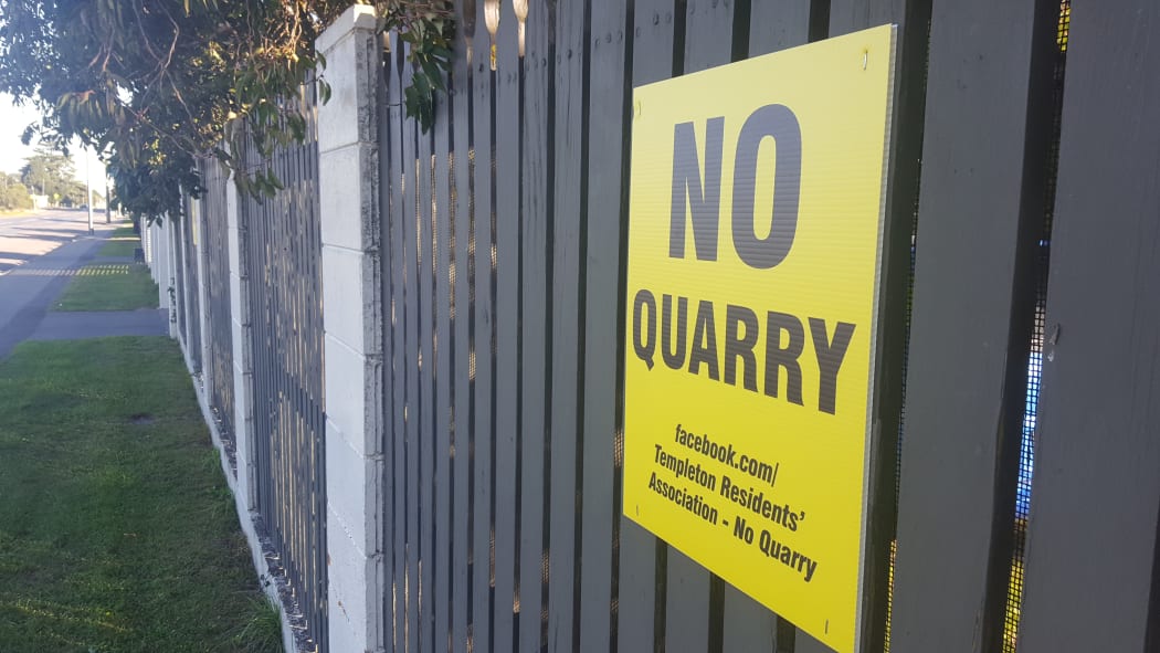 An anti-quarry sign in Templeton. Dozens are stuck on fences throughout the community.