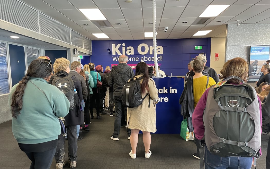 Passengers queuing to be rebooked on the 1.30pm sailing after the 8.15am sailing was turned back.
