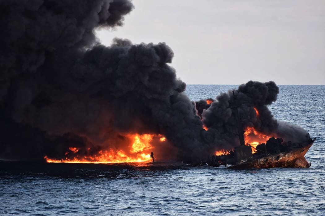 This handout file picture from the Transport Ministry of China taken and released on January 14, 2018 shows smoke and flames coming from the burning oil tanker "Sanchi" at sea off the coast of eastern China.