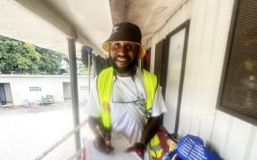 A PNG enumerator collects census data on paper in one of Port Moresby’s largest suburbs, Gerehu on 28 June 2024.